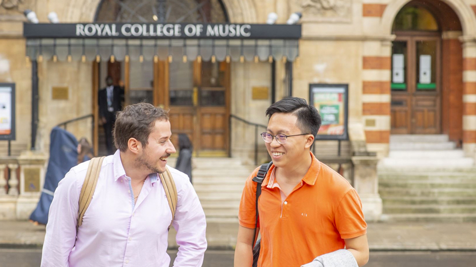 RCM students laughing outside RCM Blomfield building